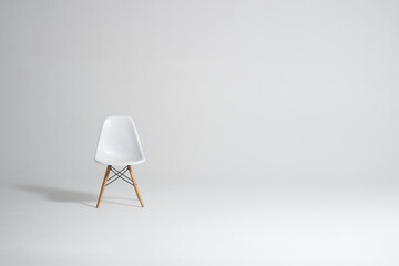 empty white chair on white background isolated with empty space for text