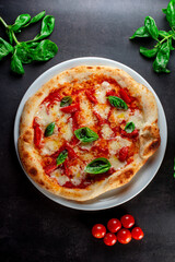 pizza with tomatoes and basil