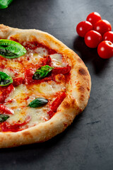 pizza with tomatoes and basil