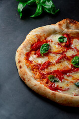 pizza with tomatoes and basil