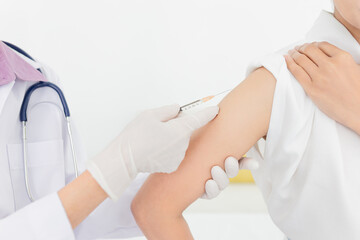 doctor inject vaccine to woman, Deltoid muscle injection technique, immunization and health care promotion