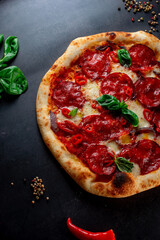 pizza with salami and tomatoes
