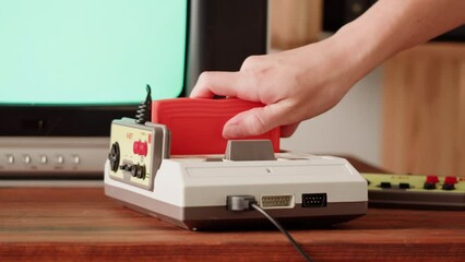 Old TV Game Console with ROM Cartridge, Vintage Gamer Room Joystick and Retro TV, Man Player Start the Game, Play.