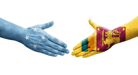 Handshake between Micronesia and Sri Lanka flags painted on hands, isolated transparent image.