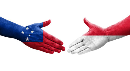 Handshake between Monaco and Samoa flags painted on hands, isolated transparent image.