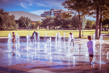 splash pad with kids at the park © Alisha