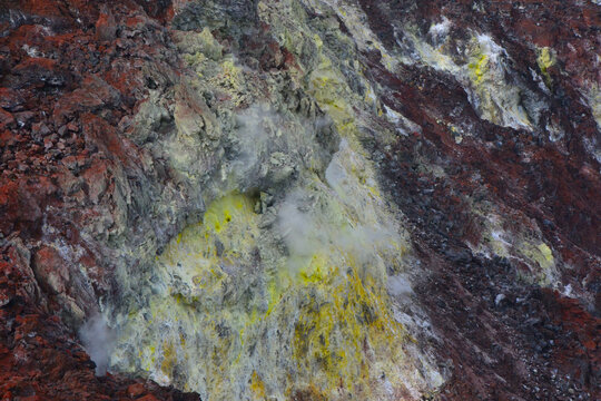 Sulfur gases and deposits in volcano.