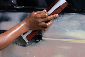 Standard auto repair shop is repairing and repainting the car after the accident.