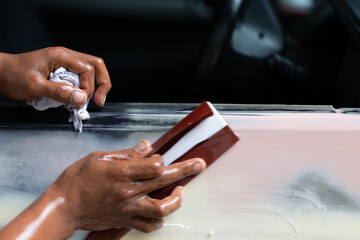 Standard auto repair shop is repairing and repainting the car after the accident.
