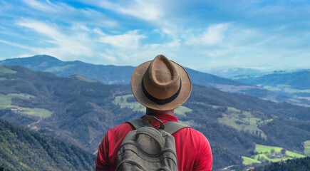 Fototapeta na wymiar Traveler Man relaxing with serene view mountains landscape- Travel Lifestyle concept
