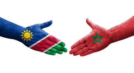 Handshake between Morocco and Namibia flags painted on hands, isolated transparent image.