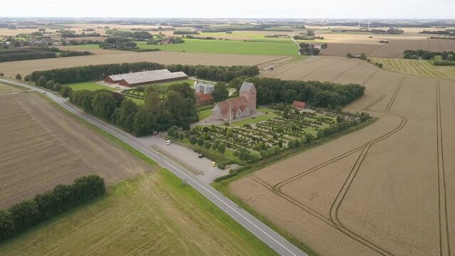 Aerial Shot of a Lutherian Middle Age Church, Graveyard and Garden And Closter in Denmark