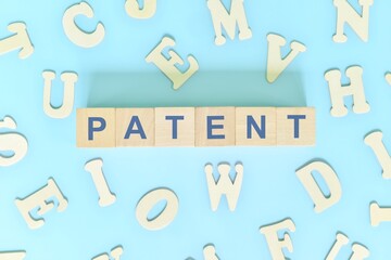 Patent business concept. Word typography on wooden blocks flat lay.