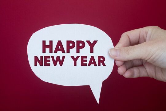 Speech bubble in front of colored background with Happy New Year text.