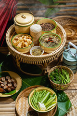 Tradition Northern Thai food. Northern Thia style food "Kan Tok". Thai cuisine nam prik or chili sauce, Thai sausages , deep fried pork skin. Thai food concept