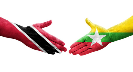 Handshake between Myanmar and Trinidad Tobago flags painted on hands, isolated transparent image.