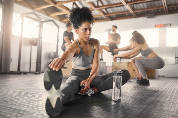 Stretching, fitness and training with black woman in gym with water bottle for exercise, sports and...