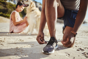Fitness, shoes and lace on beach sand for running exercise, training or workout in the outdoors. Active runner tying shoe laces for a sports run, walk or healthy cardio on the sandy ocean coast