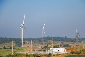 Landscape with hills and wind turbines and blue sky backgound.	 - 544783974