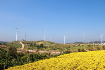 Landscape with hills and wind turbines and blue sky backgound.	 - 544783988