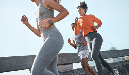 Women, black man and running in city fitness, workout or exercise for cardio health, wellness or...