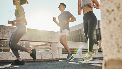 City, fitness and friends running on a road for a cardiovascular workout, exercise and marathon...