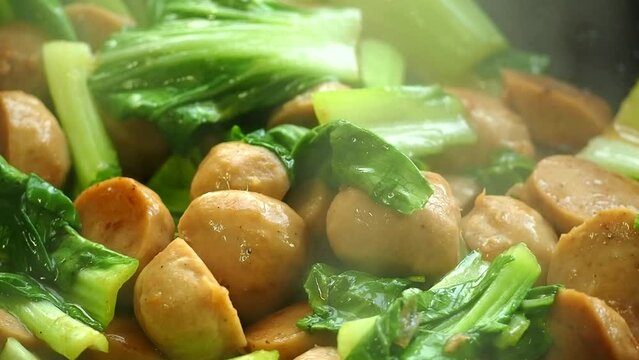 Frying vegetables with meat ball  in pan , Thai famous food