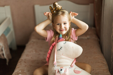 beautiful girl with unicorn in her children's room