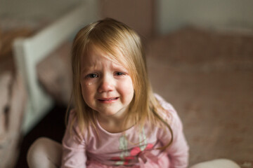 a little girl patches in her children's room. bitter tears