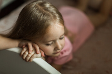 little girl sleeping on her bed in the children's room