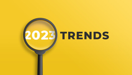 Magnifying glass magnifies 2023 trends on yellow background. Focusing on the year 2023 for technology trends update concept. 3D illustration. - obrazy, fototapety, plakaty