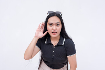 A curious asian woman wanting to listen on the latest gossip. Stunned and in disbelief. Isolated on a white background.