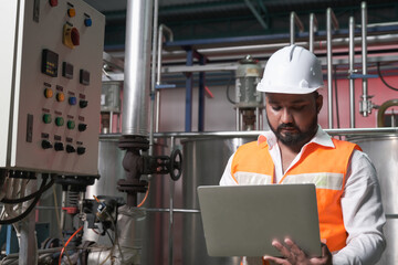 South Asia male factory worker or Man engineer or expert staff is maintenance and checking control...