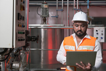 South Asia male factory worker or Man engineer or expert staff is maintenance and checking control...