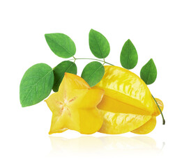 Ripe sliced and whole carambola with leaves closeup on a white background