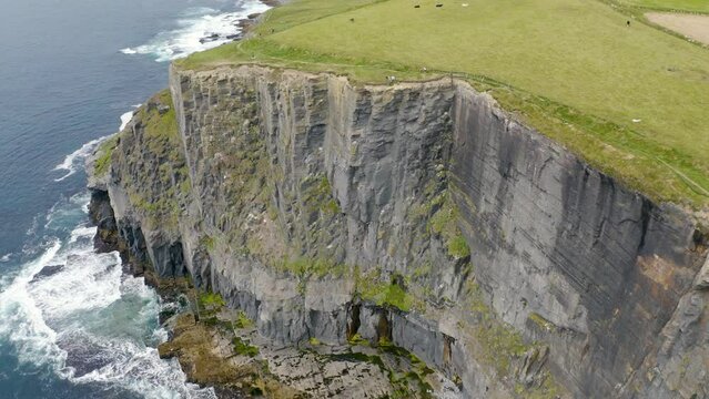 Cliffs of Moher, Ireland, Wild Atlantic Way. Atlantic Ocean. Beautiful tourist destination and attraction from above. 4K drone.