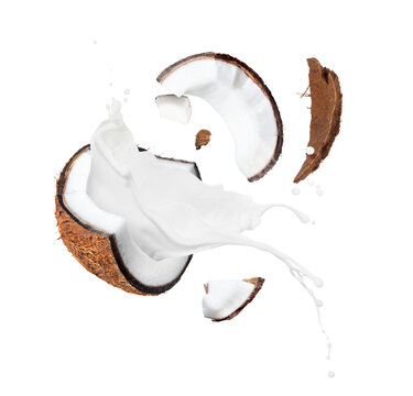 Crushed coconut with milk splashes in the air