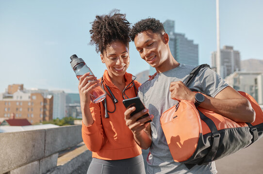 Smartphone, Fitness And Black People Couple In City For Workout Training Mobile App, Social Media And Website Information. Happy Young Sports, Athlete Or Runner Friends Using Phone In Urban Street