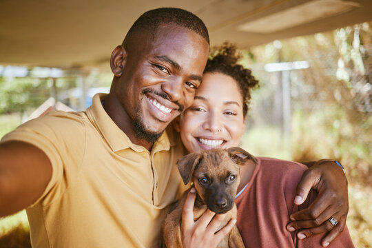 Love, dog and selfie with a couple and their adopted pet posing for a picture together in their new home. Portrait, puppy and adoption with a man, woman and foster animal taking a photograph