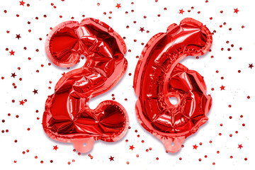 The number of the balloon made of red foil, the number twenty-six on a white background with sequins. Birthday greeting card with inscription 26. Numerical digit, Celebration event.