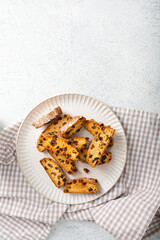 Top view of sweet cantuccini almond biscuits on plate copy space
