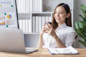 Business woman using calculator for do math finance on desk in Home office, Asian female finance business tax, accounting, statistics and analytic research concept