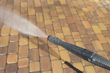 Cleaning backyard paving tiles with high pressure washer. Spring clean up. Cleaning dirty backyard...