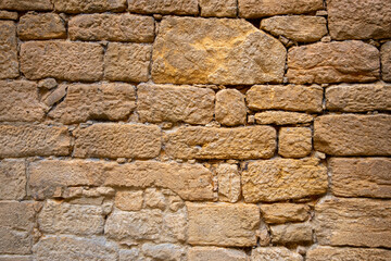 rock stone wall of brick horizontal old weathered handcrafted stones background facade