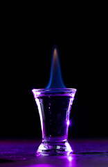 Burning alcoholic cocktail in a glass.