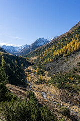 Fototapeta na wymiar Mine Valley in Livigno on a beautiful clear day in fall season on the italian Alps.
