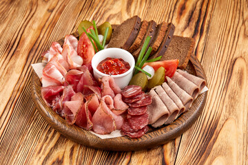 meat appetizer on the wooden background