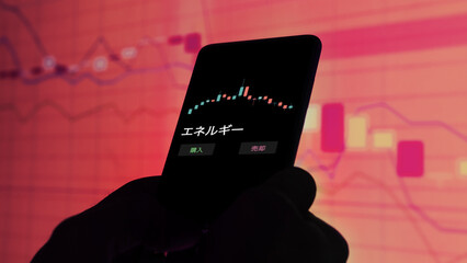 投資家が携帯電話で エネルギー ETF を分析している .