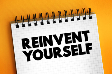 Reinvent Yourself text on notepad, concept background