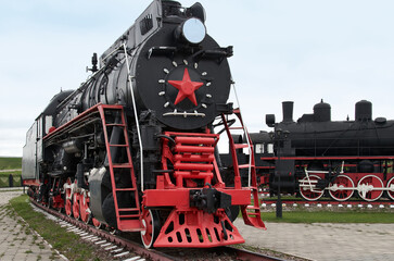 Restored vintage black steam locomotive parked in a museum